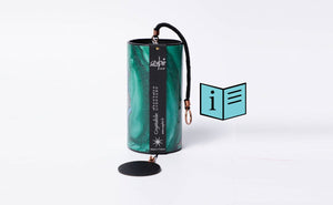 Zaphir Crystalide wind chime in gold-marbled green representing the Spring season displayed alongside a downloadable PDF info leaflet, providing tuning notes and guidance for the Zaphir Crystalide chime